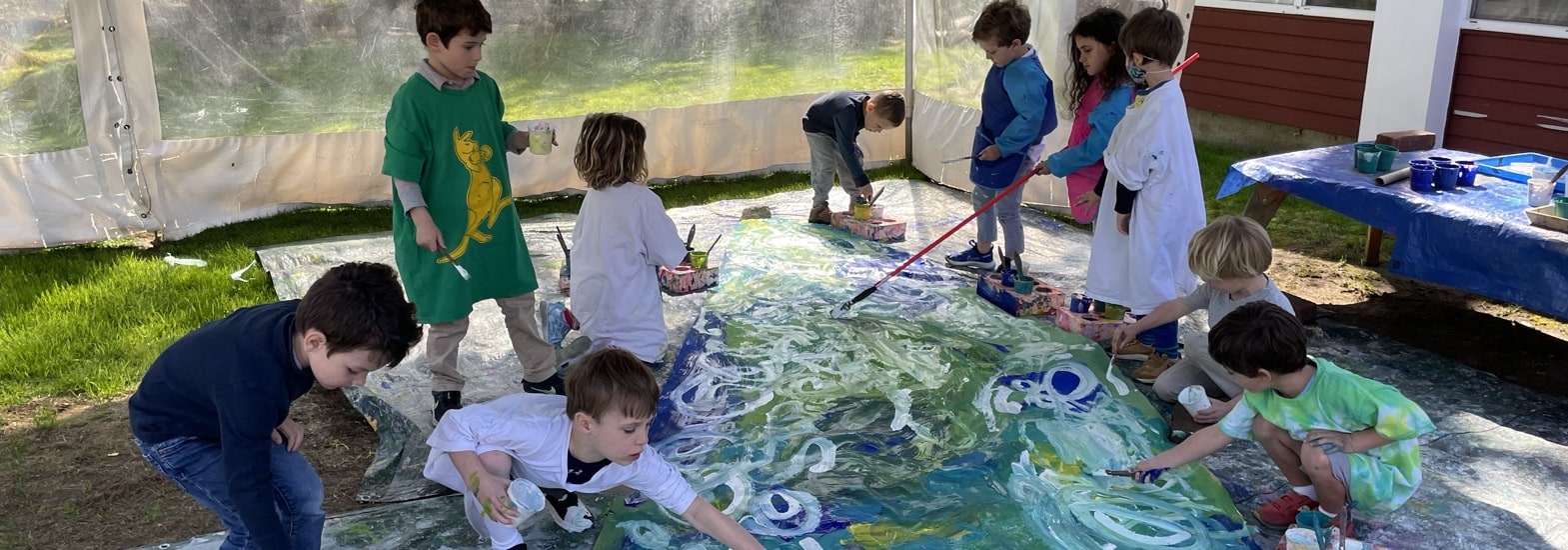Children exploring floor paint