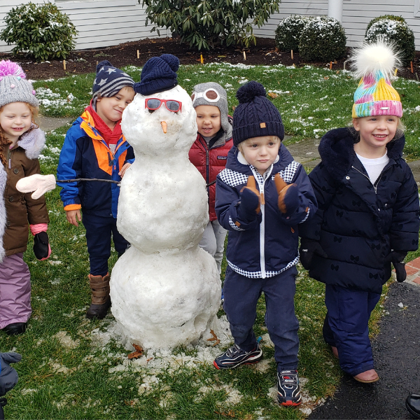 children building a snowman