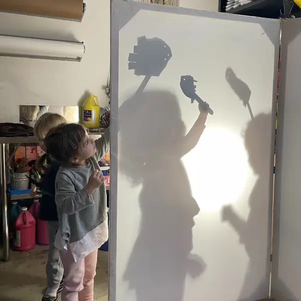 Students painting silhouettes